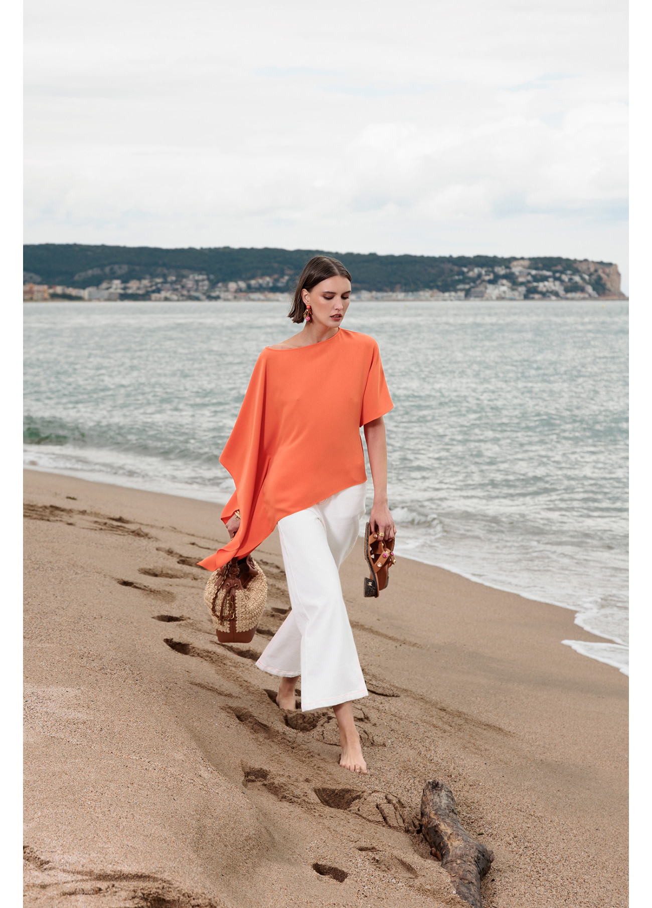 Blouse – Orange one-sleeved cape